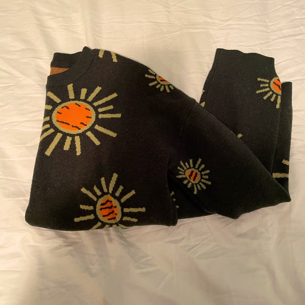 green sweater w suns